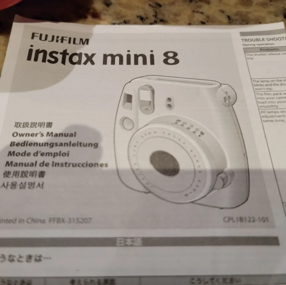Fujifilm instax 8 camera with 27 packs of film